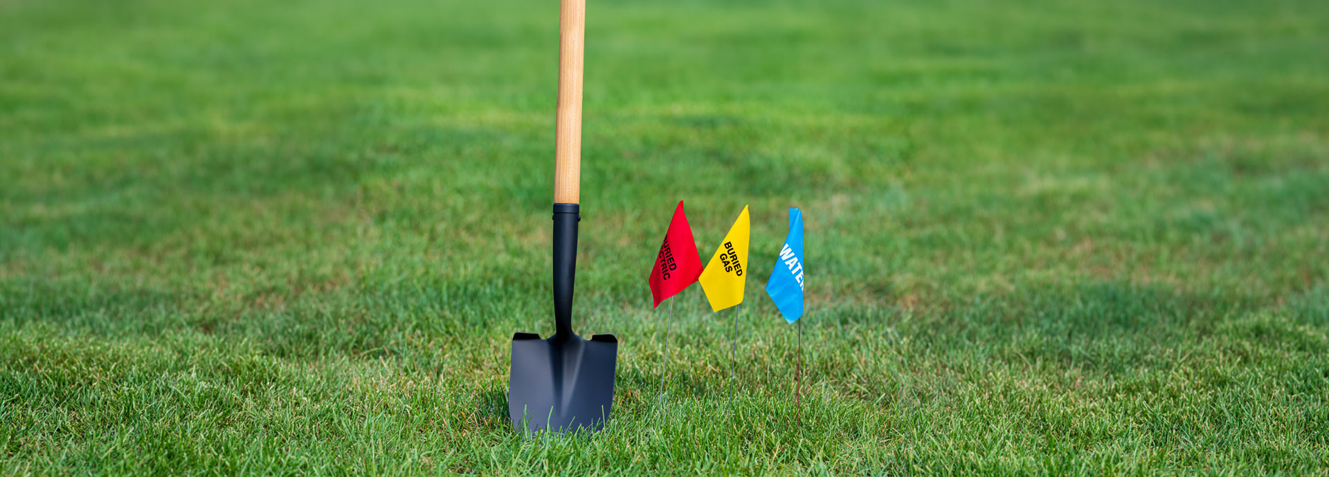 shovel and flags in the ground